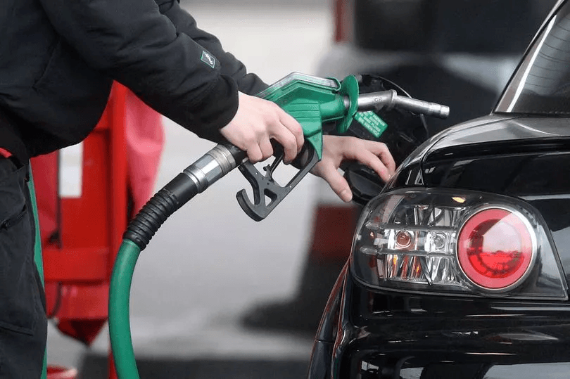 Person refueling a car