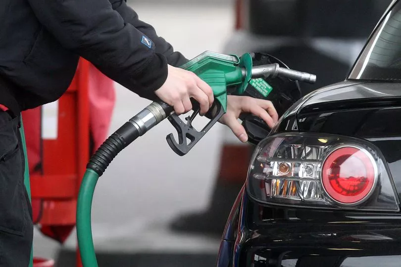 Person refueling a car